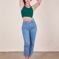 Alex is wearing Halter Top in Hunter Green and Frontier Jeans