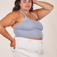 Angled view of Halter Top in Periwinkle and vintage off-white Western Pants worn by Alicia.