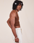Side view of Halter Top in Fudgesicle Brown and vintage off-white Western Pants worn by Jerrod