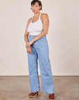 Tiara is wearing Halter Top in Vintage Off-White and light wash Sailor Jeans