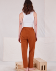 Back view of Rolled Cuff Sweat Pants in Burnt Terracotta and Cropped Tank in vintage tee off-white  on Alex