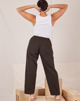 Back view of Heavyweight Trousers in Espresso Brown and Cropped Tank Top in vintage tee off-white worn by Tiara.