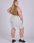 Pleated Trouser Shorts in Dishwater White angled back view on Juliet