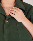 Heritage Short Sleeve Jumpsuit in Swamp Green front collar close up on Katie