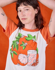 Anniversary Tee in Orange Blossom front close up on Alex