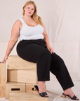 Juliet is wearing Heritage Trousers in Basic Black and Cropped Tank in vintage tee off-white