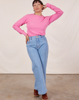 Tiara is wearing Honeycomb Thermal in Bubblegum Pink tucked into light wash Sailor Jeans