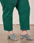 Side view pant leg close up of Petite Short Sleeve Jumpsuit in Hunter Green on Ashley