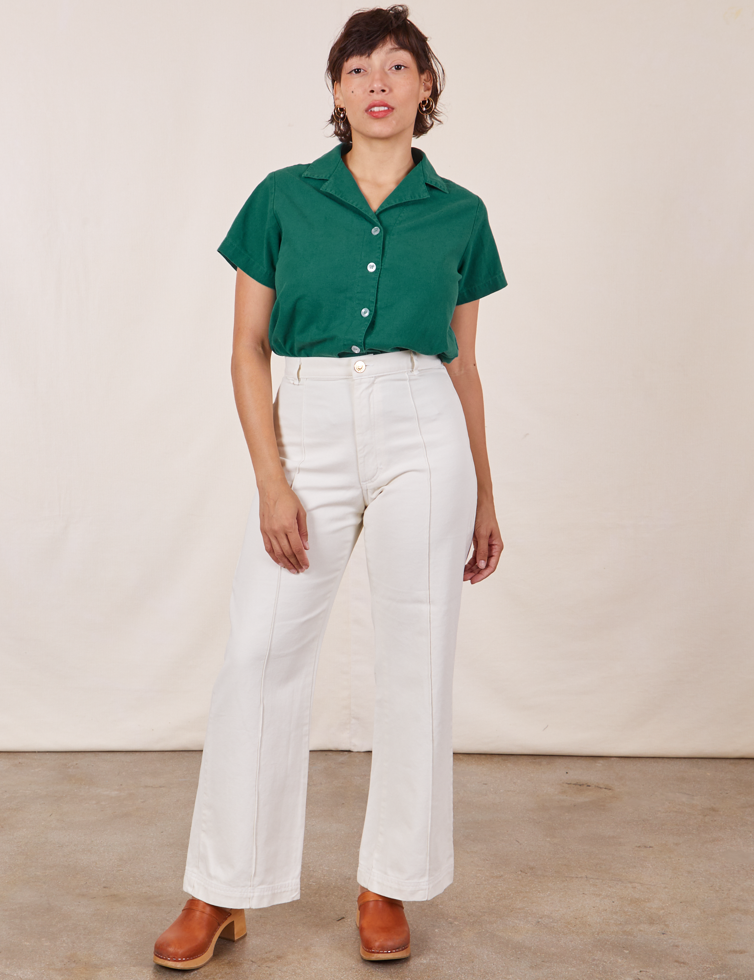 Tiara is wearing Pantry Button-Up in Hunter Green and vintage off-white Western Pants