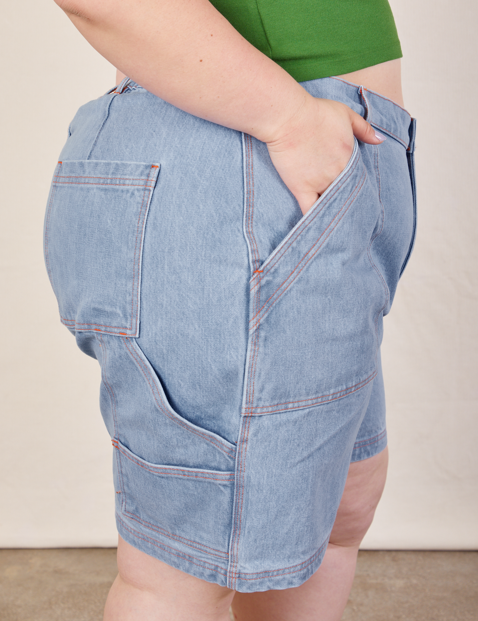 Close up side view of Carpenter Shorts in Light Wash on Ashley