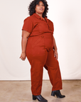 Angled view of Short Sleeve Jumpsuit in Paprika worn by Morgan