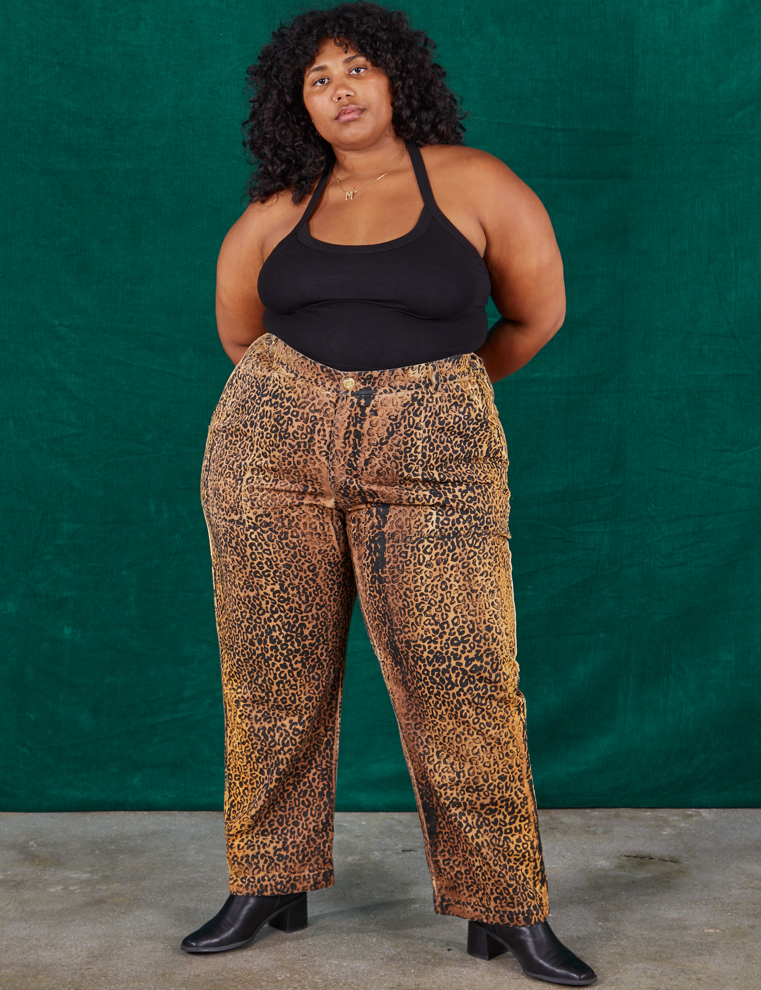 Morgan is 5&#39;5&quot; and wearing 2XL Leopard Work Pants and black Halter Top