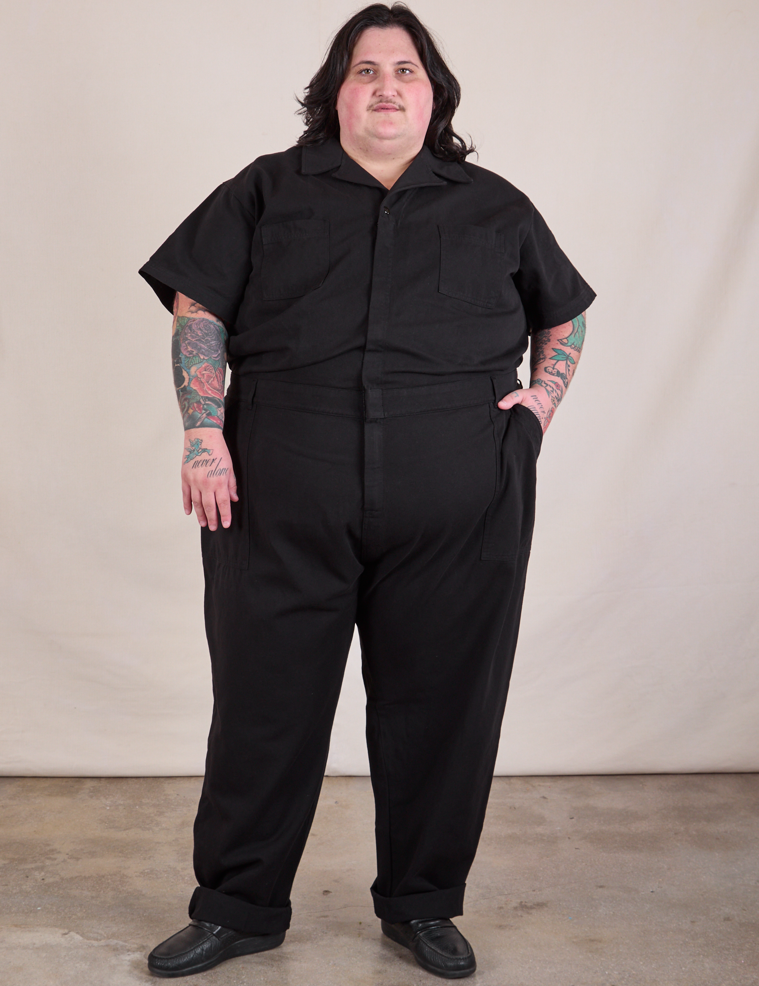 Sam is 5'10" and wearing 4XL Long Jumpsuit in Basic Black
