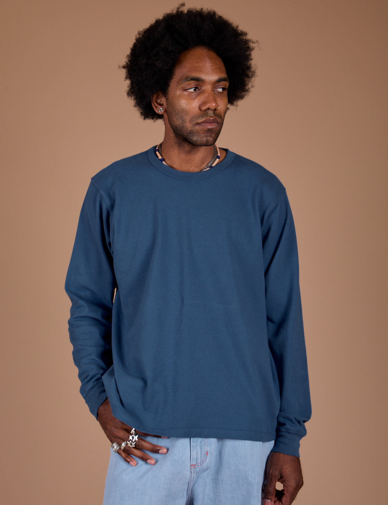 Jerrod is 6’3” and wearing M Long Sleeve Burly Tee in French Blue