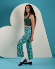 Side view of Work Pants in Angel Print and Cropped Tank in Swamp Green on Shahana