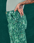Side view close up of Marble Splatter Work Pants in Hunter Green on Jesse