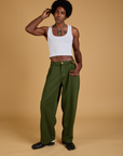 Jerrod is 6'3" and wearing M Baggy Mid-Rise Trousers in Evergreen