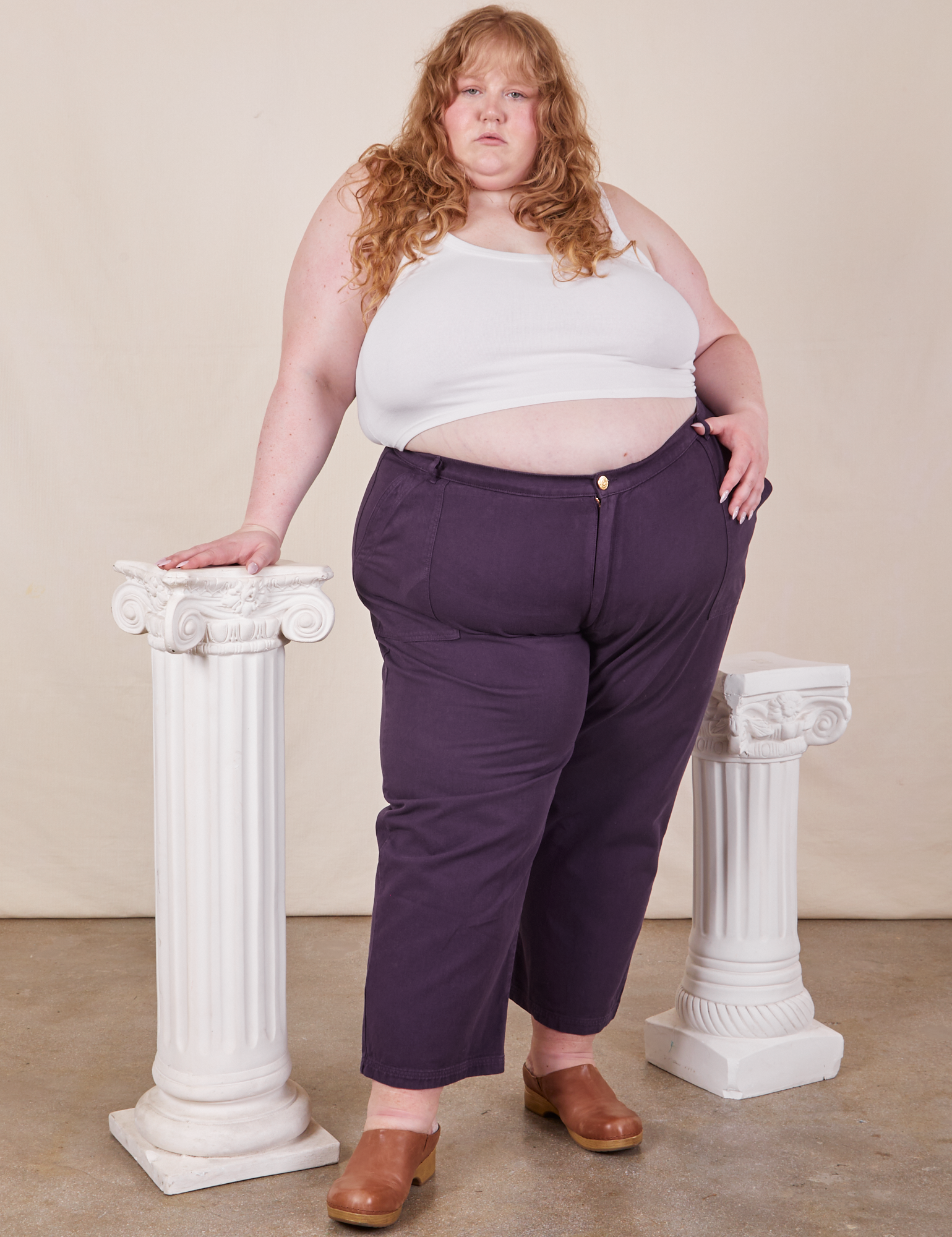 Catie is wearing Work Pants in Nebula Purple and Cropped Cami in vintage tee off-white 