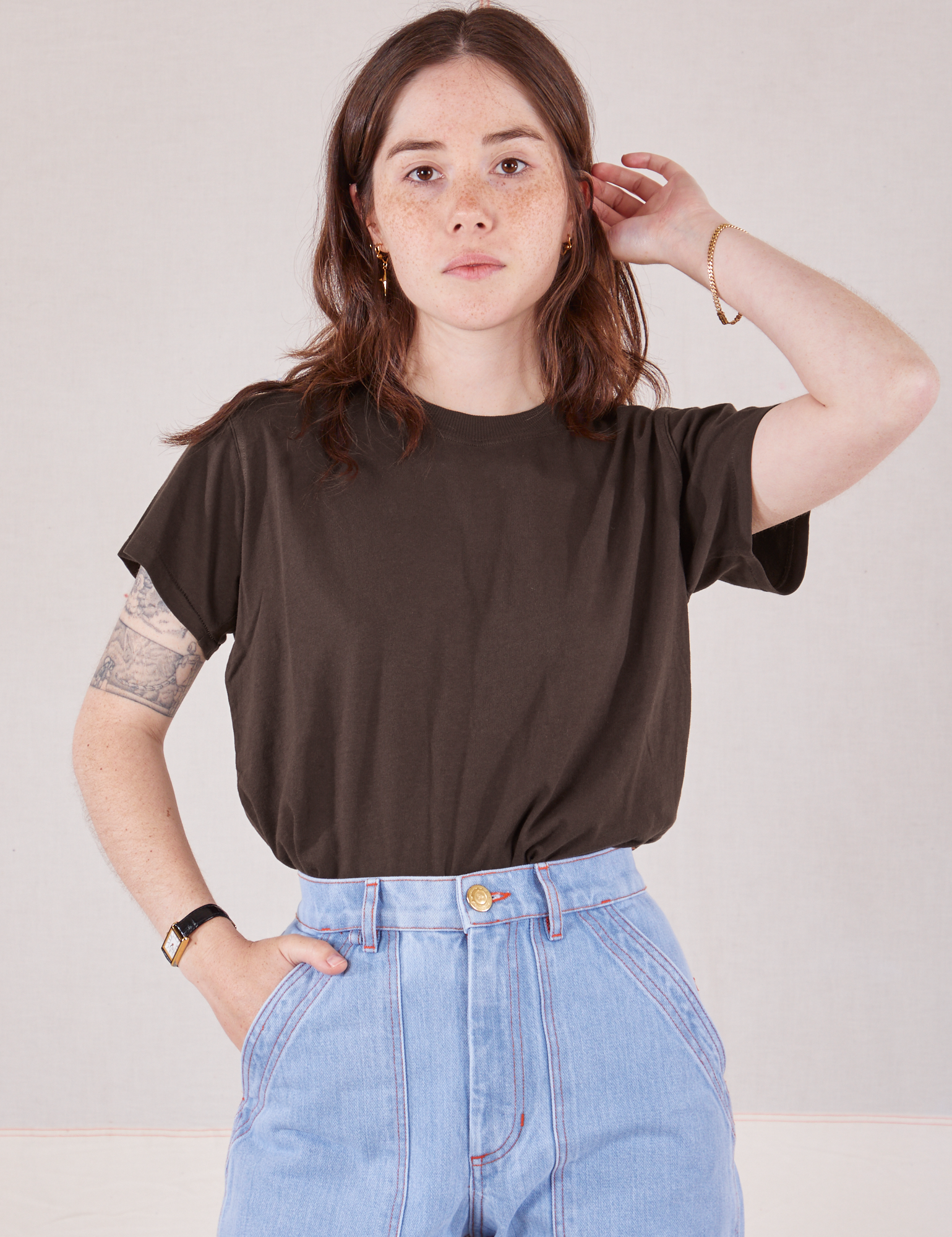 Hana is wearing Organic Vintage Tee in Espresso Brown tucked into light wash Carpenter Jeans