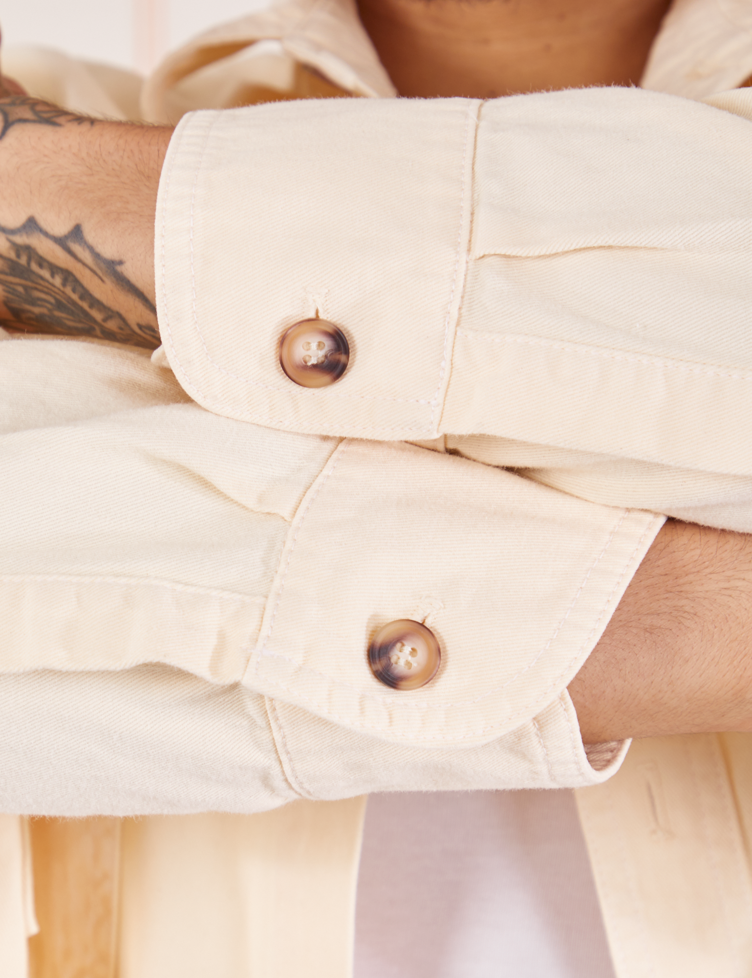 Sleeve cuff close up of Oversize Overshirt in Vintage Tee Off-White worn by Jesse