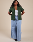 Pantry Button-Up in Swamp Green and light wash Indigo Wide Leg Trousers on Meghna