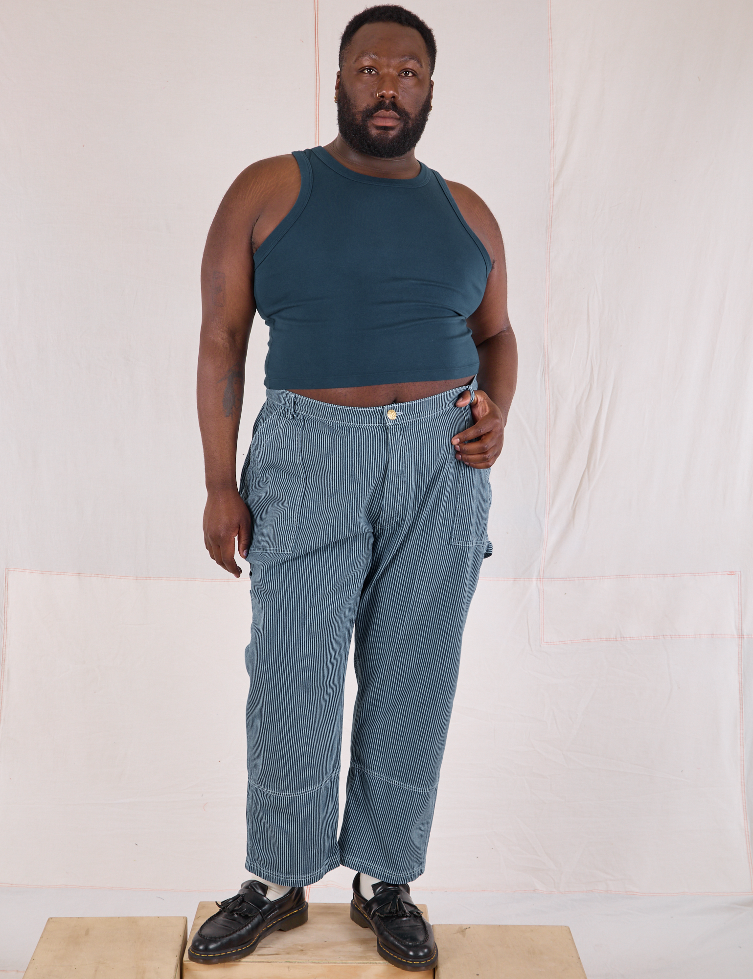 Elijah is 6’4” and wearing 3XL Railroad Carpenter Jeans in Baby Blue paired with marine blue Muscle Tee
