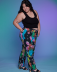 Side view of Work Pants in Rainbow Magic Waters and black Cropped Tank on Ashley