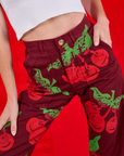 Close up of Paintstamped Work Pants in Cherry on Madeline