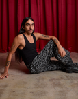 Anthony is wearing Drop Pocket Cargo Pants in Spider Webs and black Cropped Tank