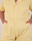 Short Sleeve Jumpsuit in Butter Yellow front close up on Miguel