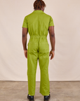 Short Sleeve Jumpsuit in Gross Green back view on Issac