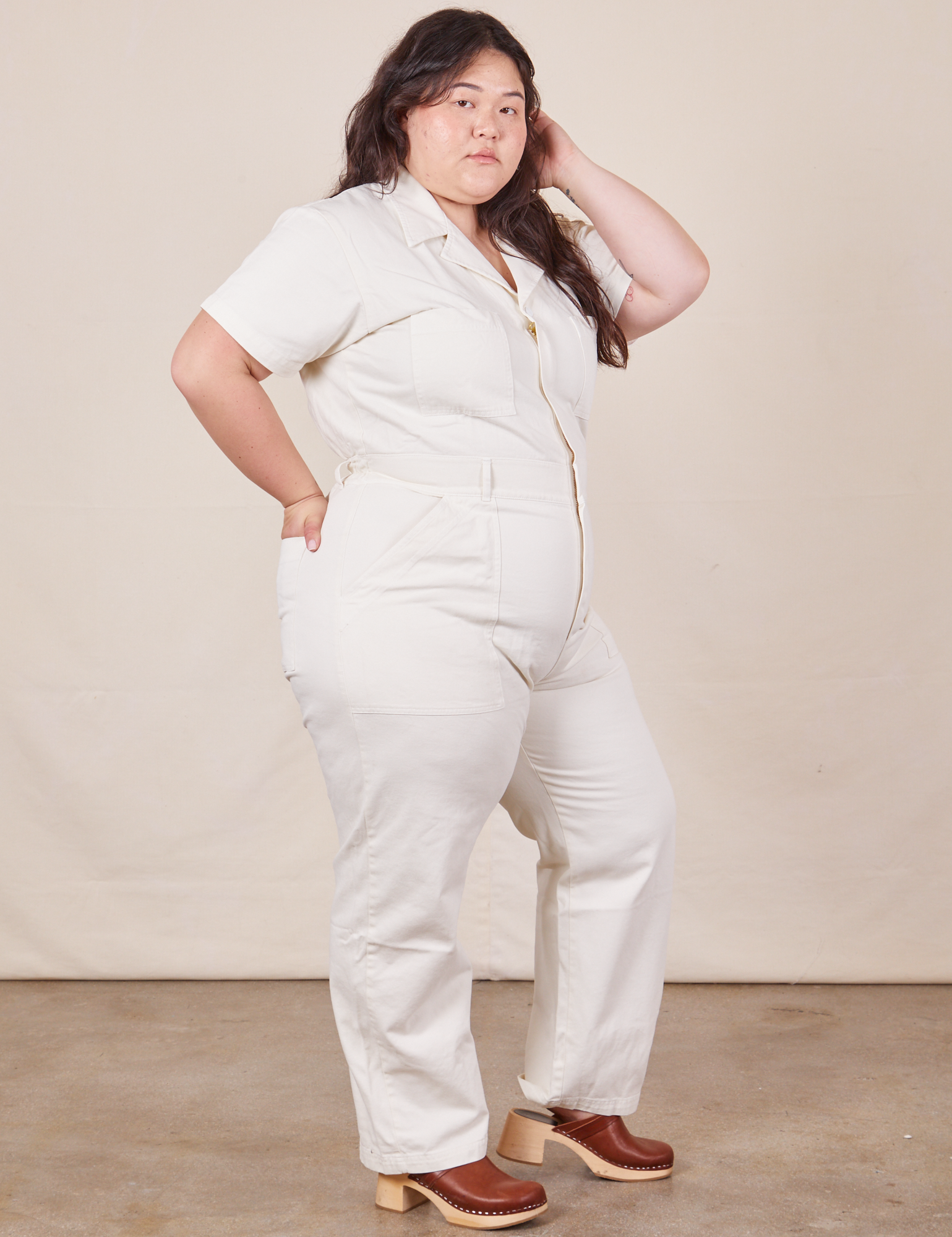 Angled view of Short Sleeve Jumpsuit in Vintage Tee Off-White worn by Ashley