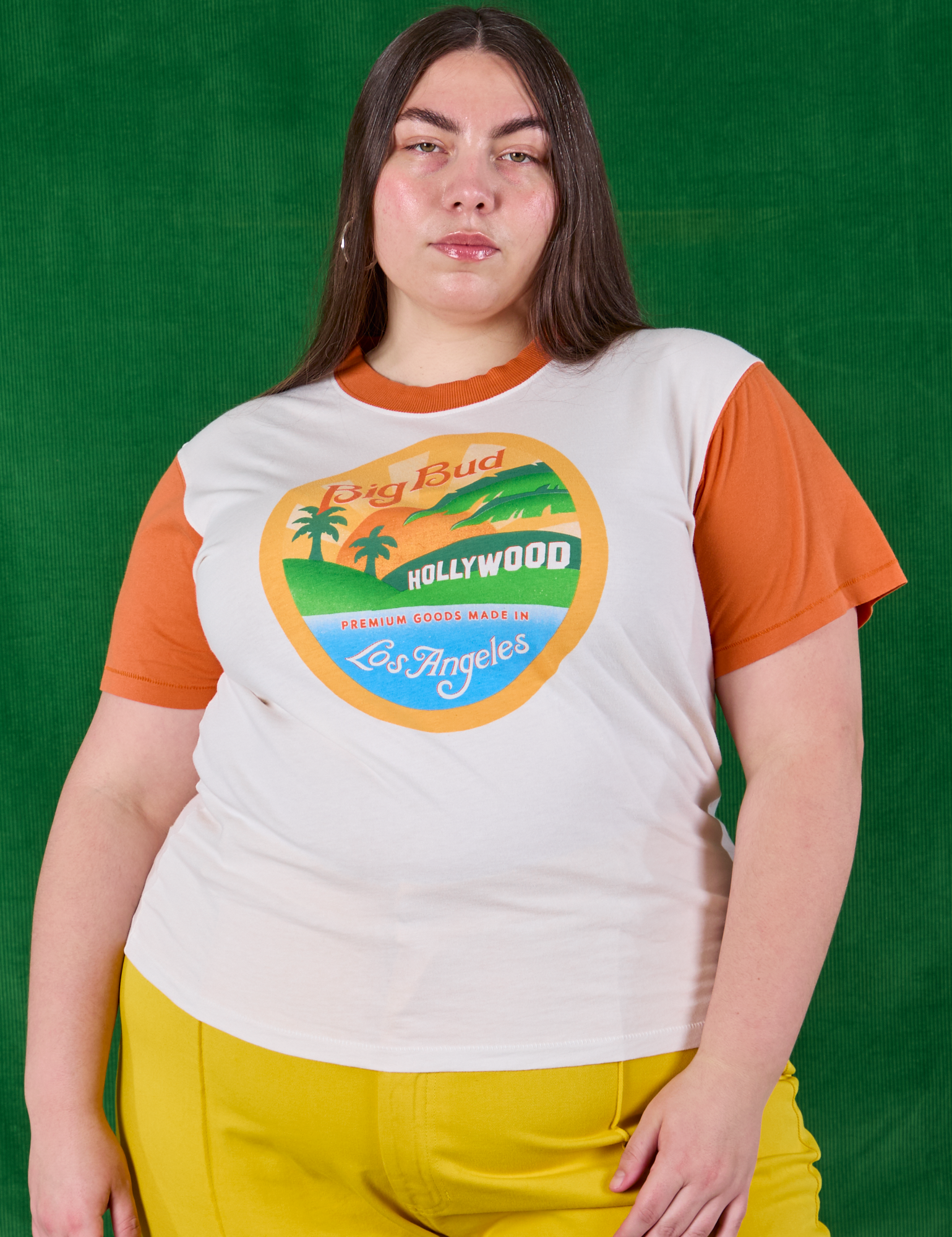 Marielena is 5'8" and wearing L Hollywood Tourist Tee