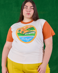 Marielena is 5'8" and wearing L Hollywood Tourist Tee