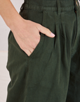 Heavyweight Trousers in Swamp Green font pocket close up. Madeline has her hand in the pocket.