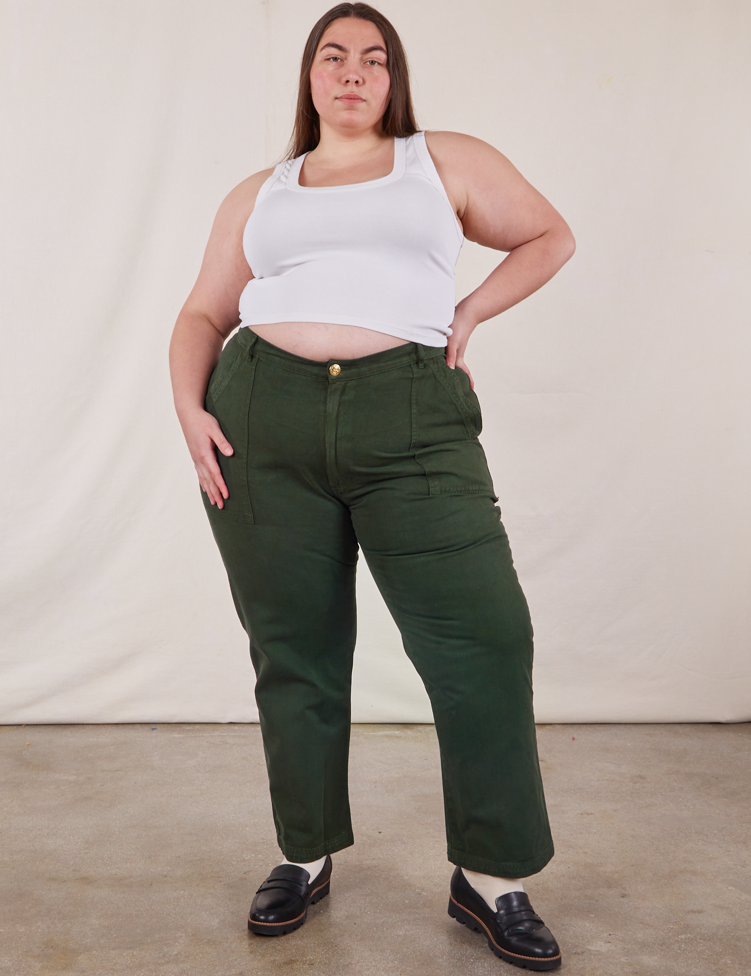 Marielena is 5&#39;8&quot; and wearing 2XL Work Pants in Swamp Green paired with vintage tee off-white Cropped Tank