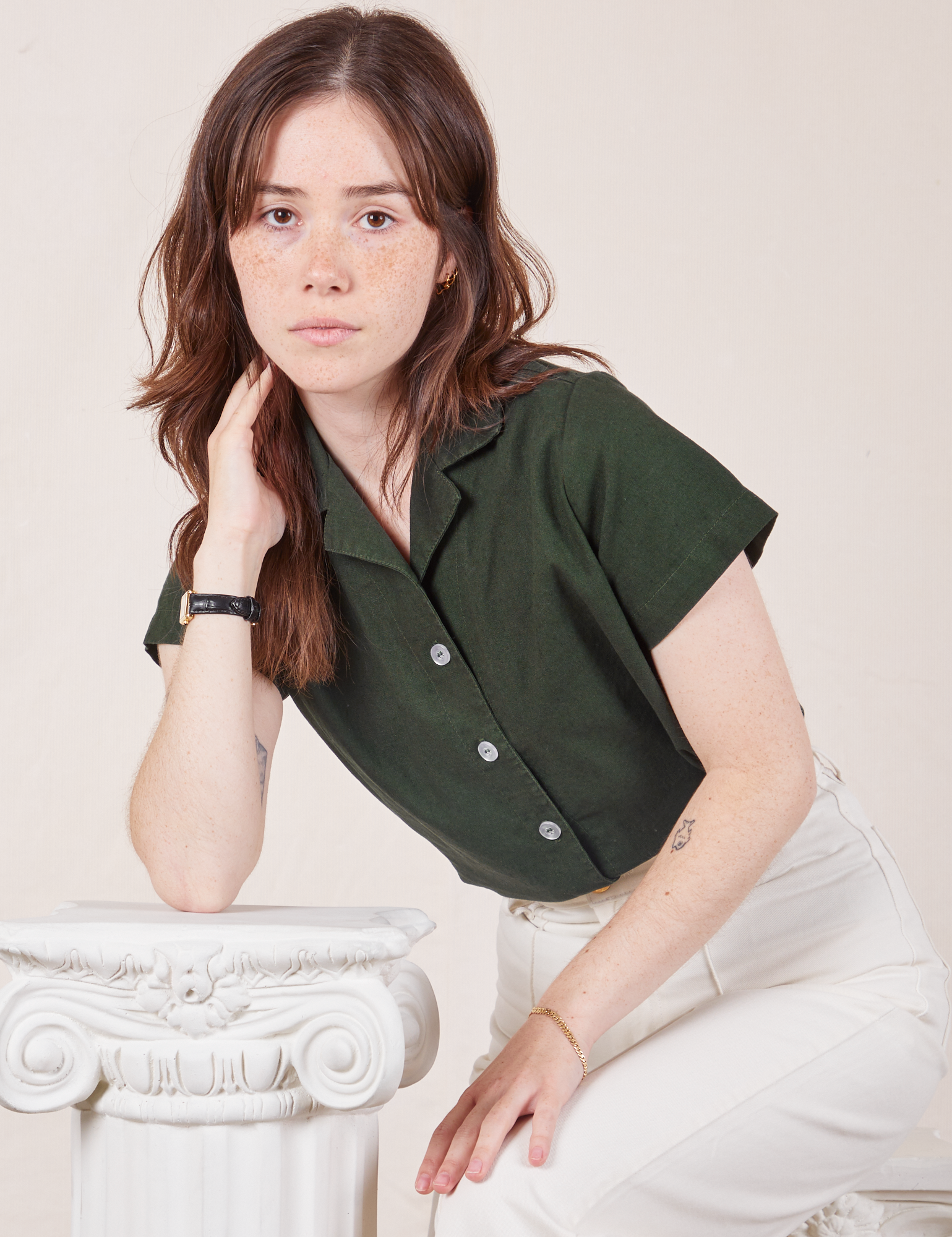 Hana is wearing Pantry Button-Up in Swamp Green