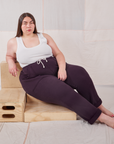 Marielena is wearing Rolled Cuff Sweat Pants in Nebula Purple and vintage off-white Cropped Tank