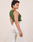 Angled back view of Tank Top in Dark Emerald Green on Mika