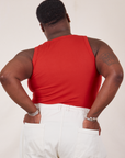 Back view of Tank Top in Mustang Red and vintage tee off-white Western Pants on Elijah