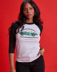 Kandia is 5'3" and wearing XS Taxi Raglan Tee in Los Angeles