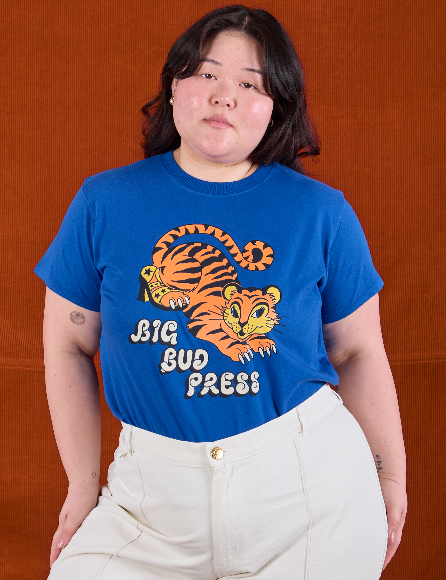 Ashley is wearing BBP Tiger Tee tucked into vintage tee off-white Western Pants