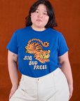Ashley is wearing BBP Tiger Tee tucked into vintage tee off-white Western Pants