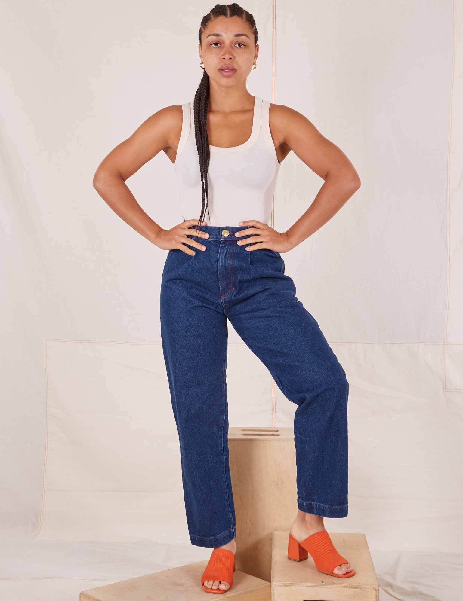 Gabi is 5&#39;7&quot; and wearing XXS Denim Trouser Jeans in Dark Wash paired with Tank Top in vintage tee off-white