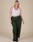 Lish is 5'8" and wearing XL Heavyweight Trousers in Swamp Green paired with a Cropped Tank in Vintage Tee White