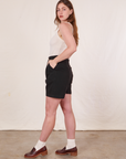 Side view of Trouser Shorts in Basic Black and vintage off-white Tank Top worn by Allison