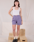Alex is 5’8” and wearing XXS Trouser Shorts in Faded Grape paired with a Cropped Tank in vintage tee off-white