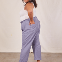 Side view of Western Pants in Faded Grape worn by Alicia. She has her hand in one of the pockets.