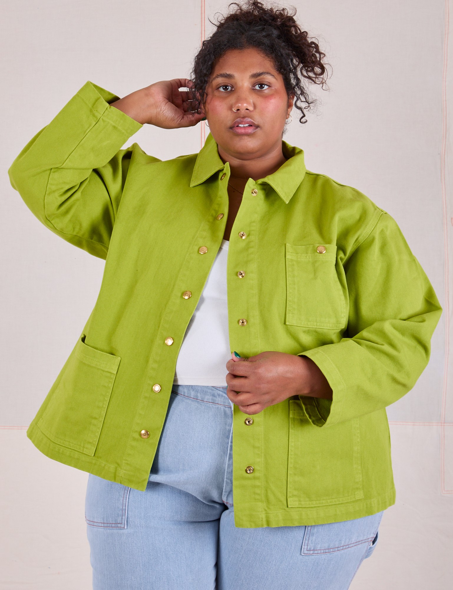 Morgan is 5'5" and wearing 1XL Denim Work Jacket in Gross Green