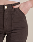 Close up of Alex's hand in the back pocket of Work Pants in Espresso Brown
